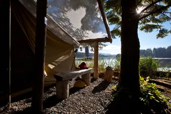 waterfront canvas tent with morning sunshine