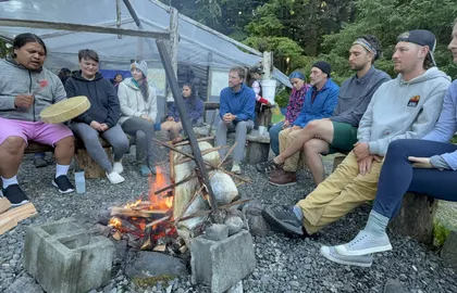 cultural sharing and drumming with Leroy Jack and guests around fire with salmon cooking