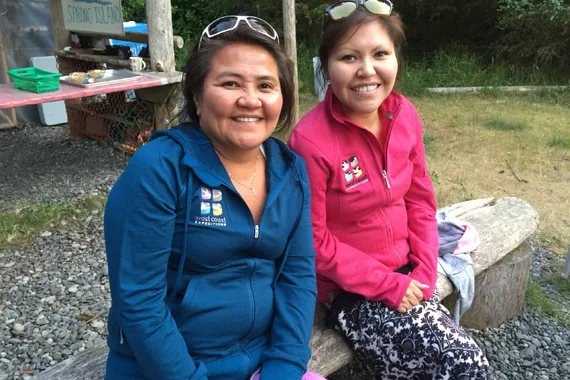 Lana and Ariel around the fire for cultural sharing